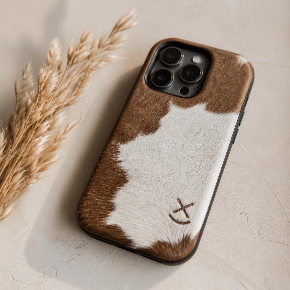 Cowhide phone case branded with a custom ranch mark